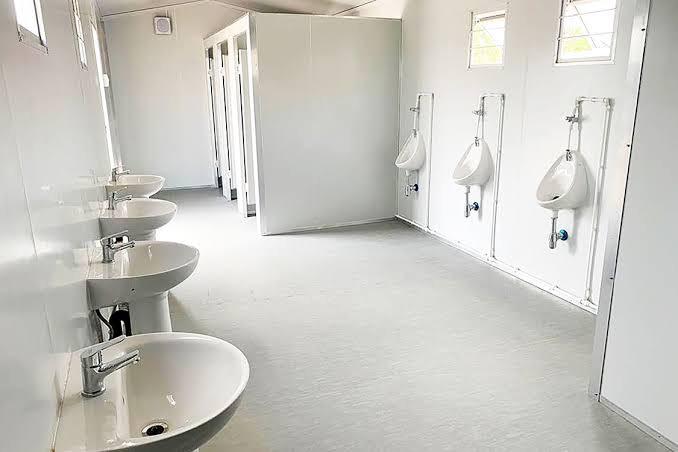Prefabricated ablution facility with toilets and showers for site use